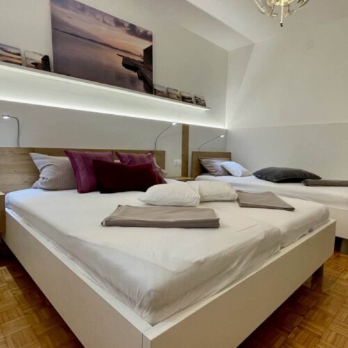 Modern bedroom with two beds.