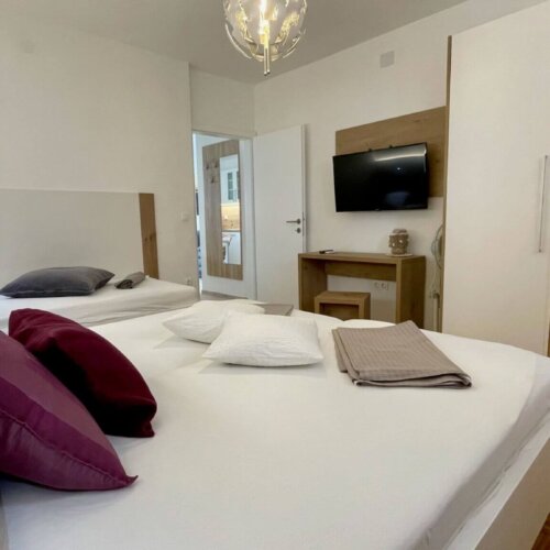 Modern bedroom with two beds.