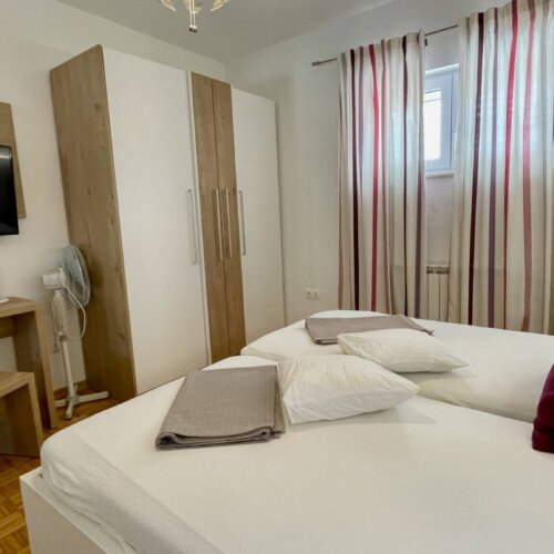 Cozy bedroom with modern furnishings.